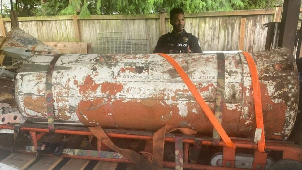 An officer near the rusty rocket