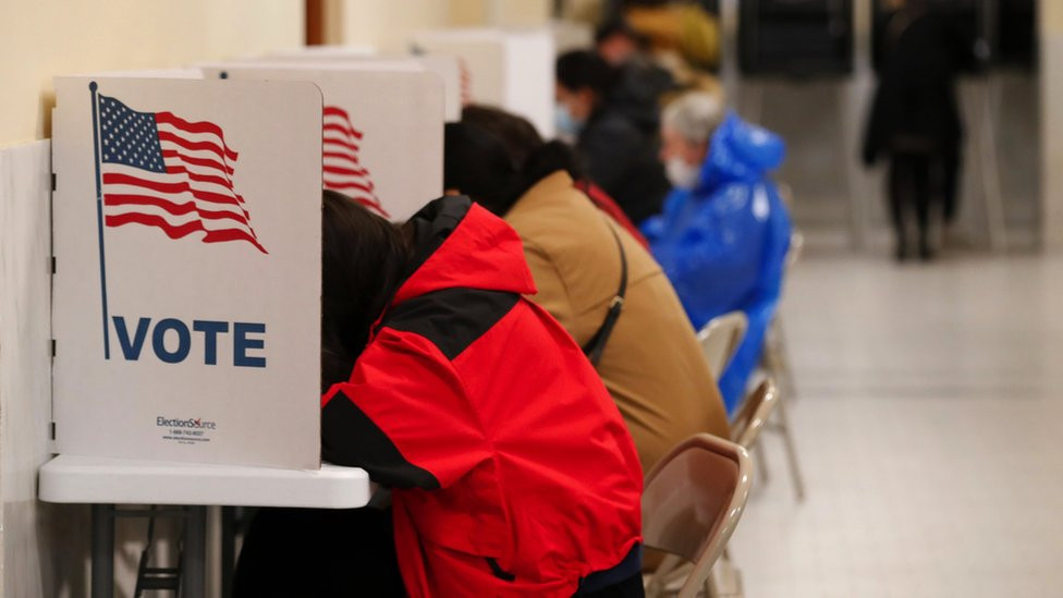 People at voting booths in California on 8 November 2022