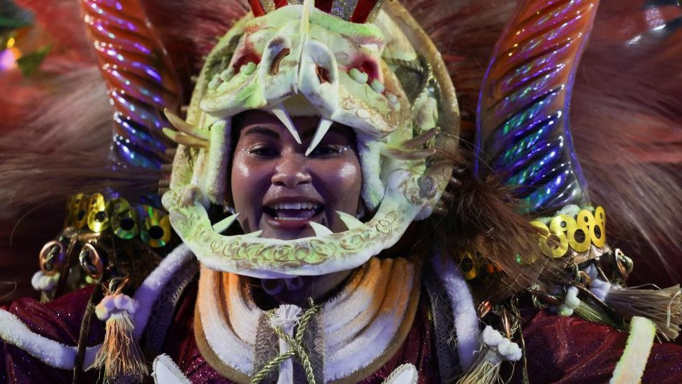 A reveller from Viradouro samba school performs during the night of the Carnival parade at the Sambadrome, in Rio de Janeiro, Brazil February 13, 2024.