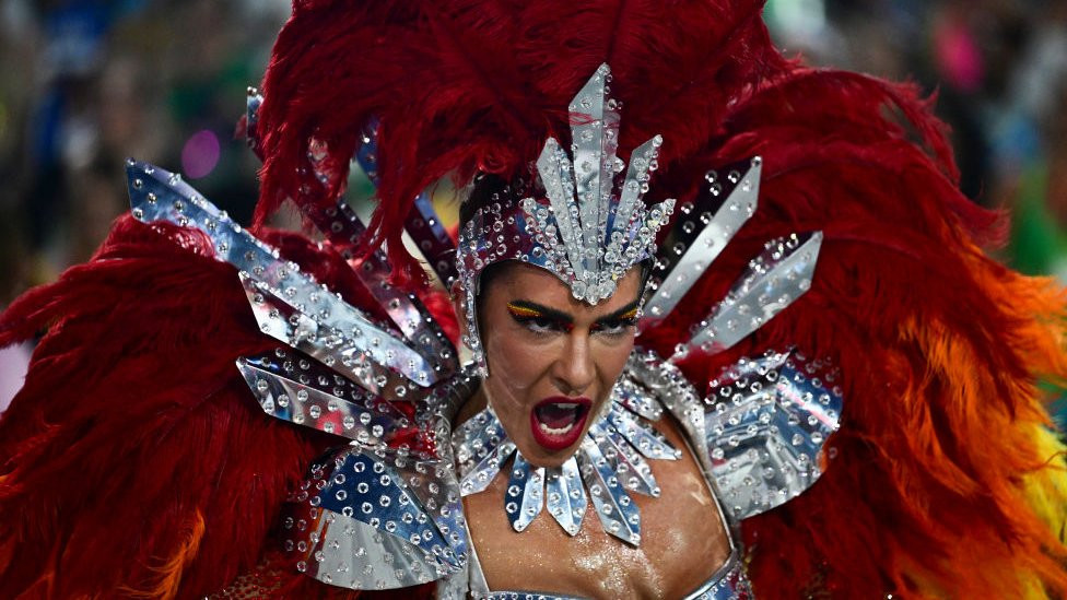 A member of the Unidos do Viradouro samba school performs during the last night of the Carnival parade at the Marques de Sapucai Sambadrome in Rio de Janeiro, Brazil, on February 13, 2024.