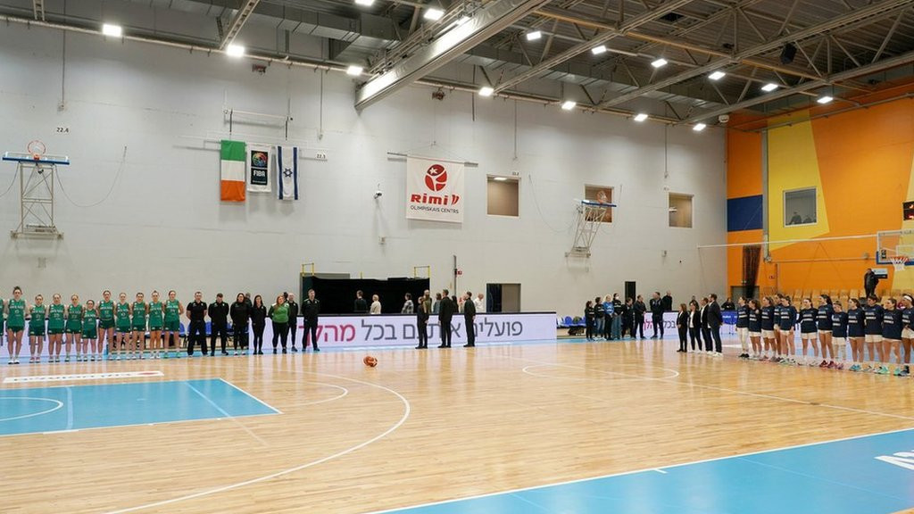 Ireland line up for their national anthem by the team's bench