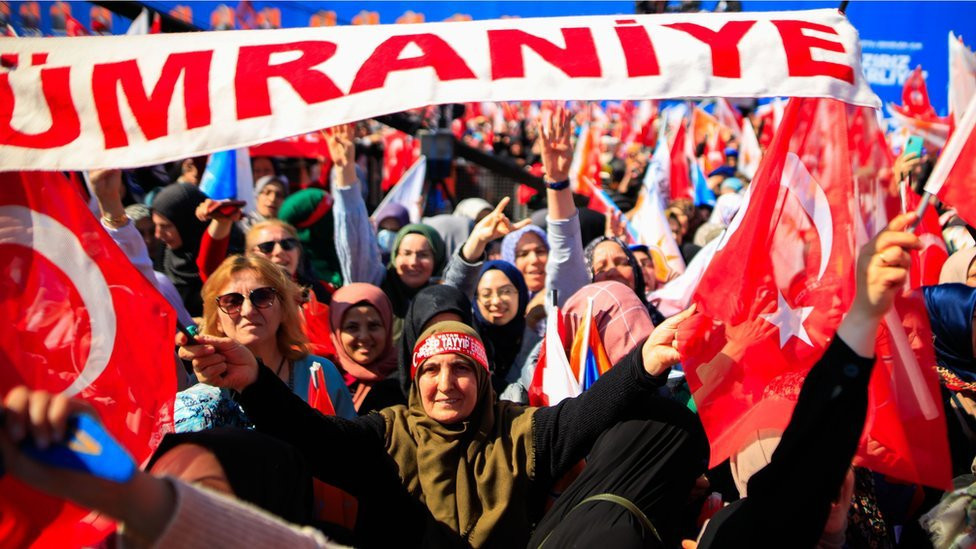 2024/03/24: Women wave flags during Turkish President Recep Tayyip Erdogan's speech at the Greater Istanbul Restoration rally, which was held at Ataturk Airport ahead of the Turkish local elections.