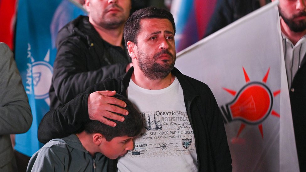 Supporters of Erdogan gather in front of the AK Party headquarters after the polls closed in Ankara, Turkey, 31 March 2024.