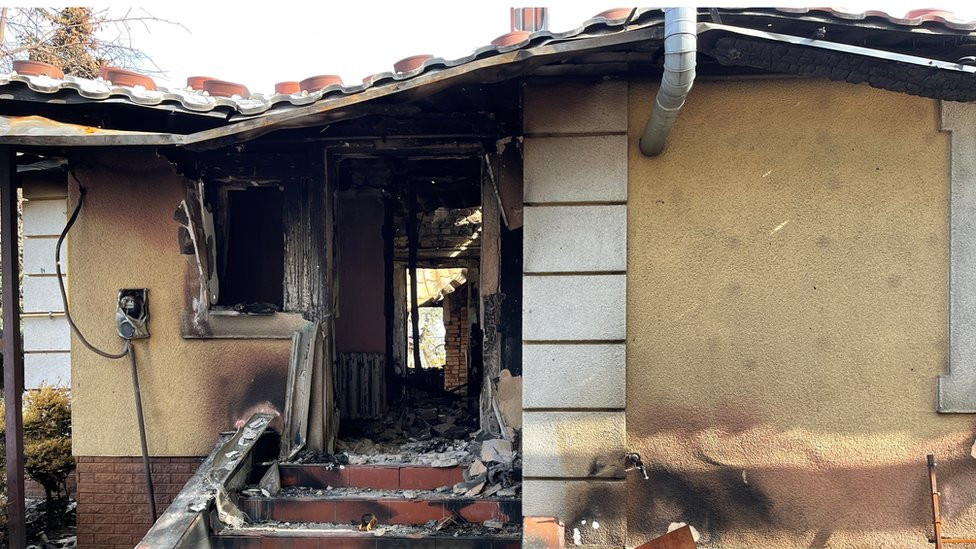 Ludmila's burnt-out house in a photo taken two years ago