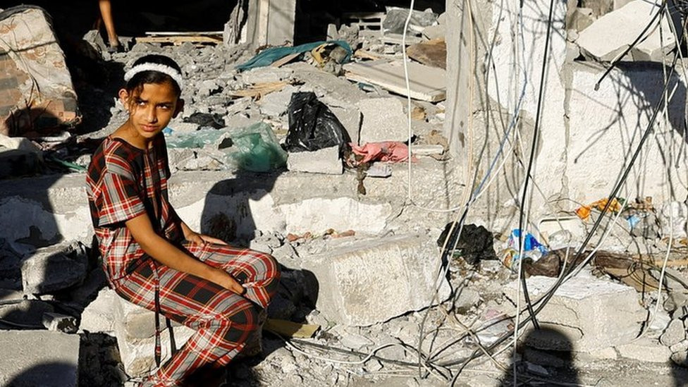 A Palestinian girl at the site of an Israeli strike on a house in Rafah