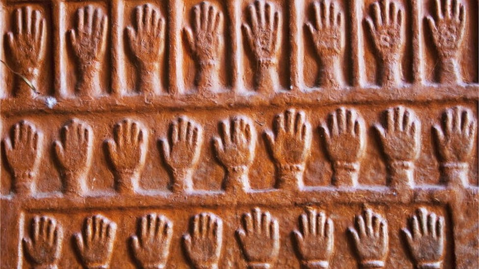 Hands commemorating women who killed themselves on the pyre of their husbands on the walls of the Mehrangarh Fort in Jodhpur, Rajasthan, India