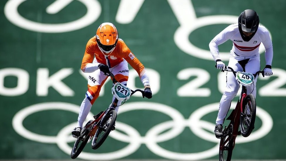 Joris Harmsen (L) in action during the men's BMX quarterfinals at the Tokyo Olympics.