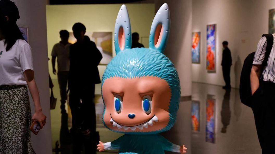 
                    A human-sized Labubu figurine is displayed before an auction in Beijing, China June 6, 2025. The figurine was later sold for 1.08 million yuan at an auction by Yongle Int