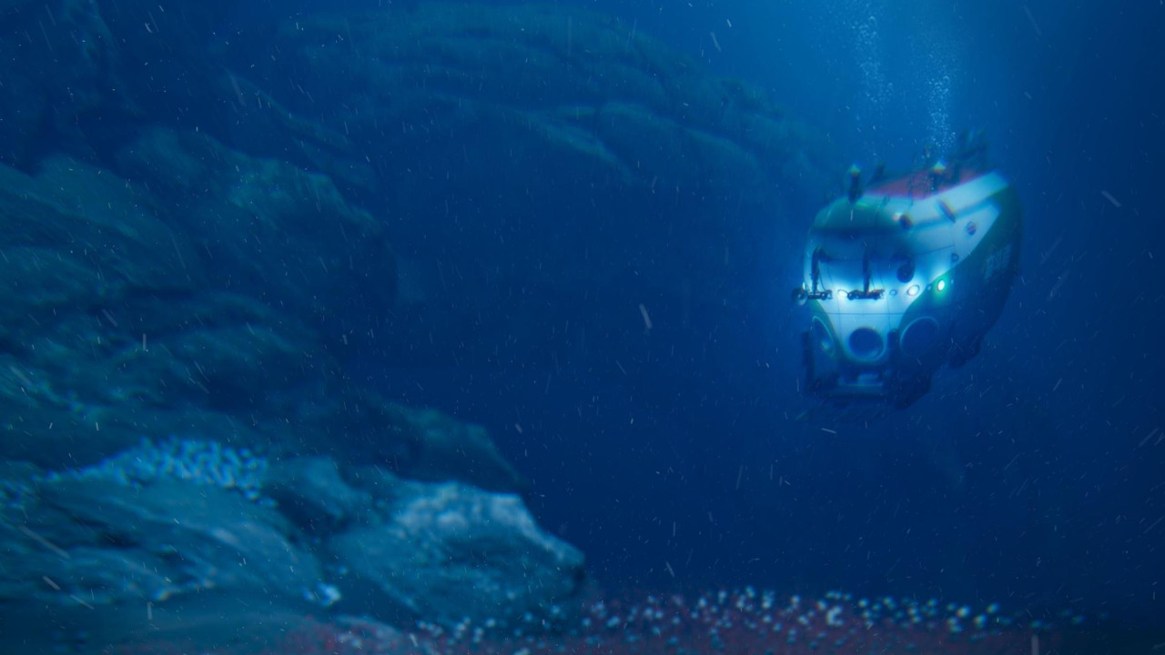 Umetnički prikaz podmornice koja istražuje duboki okeanski rov ispunjen crvenkastim cevastim crvima koji izranjaju sa okeanskog dna.