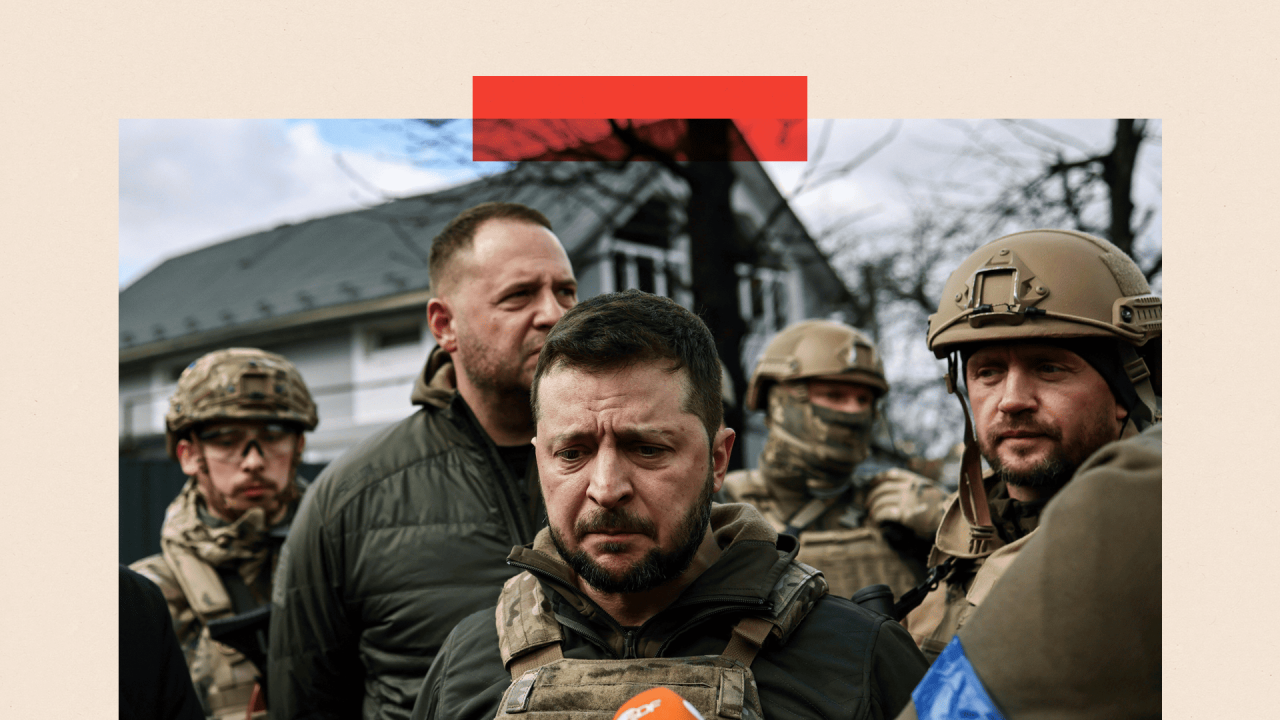 Ukainian President Volodymyr Zelensky (C) speaks to the press in the town of Bucha