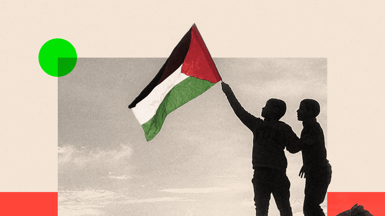  A boy runs with a Palestinian flag atop a mound of rubble at a camp