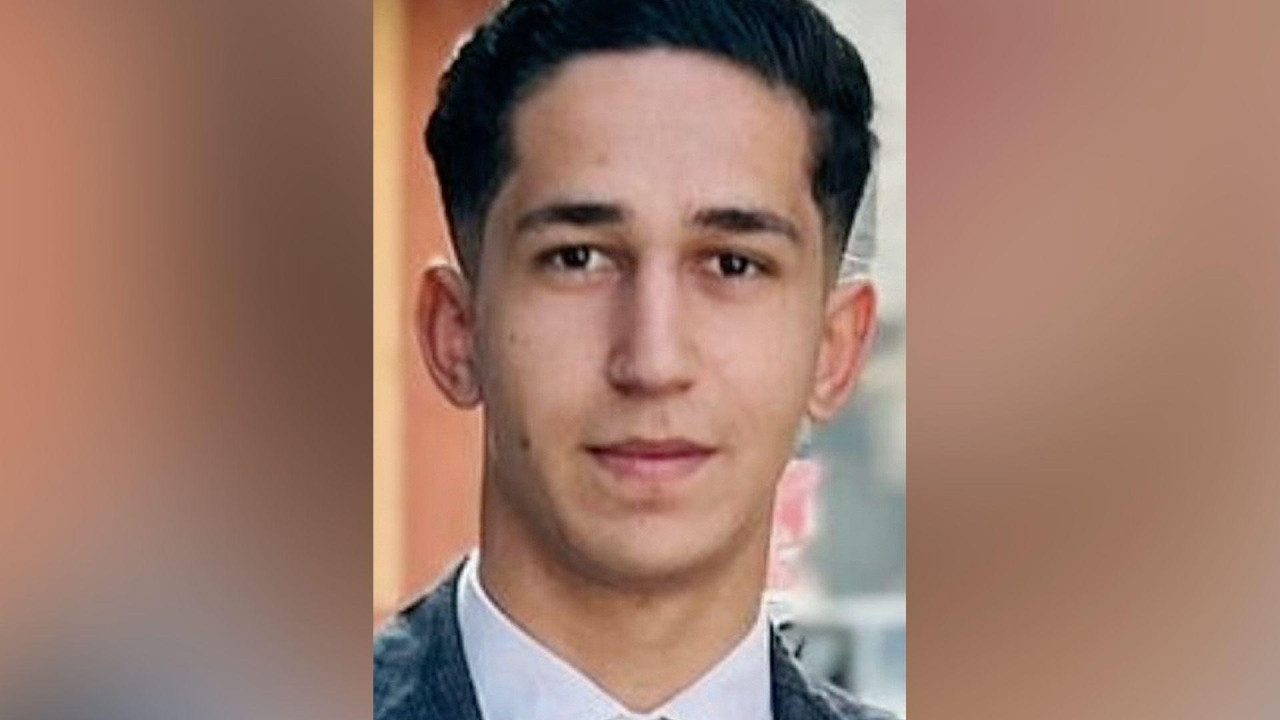 Young man - Abdullah - looking straight at the camera. He has short dark hair.