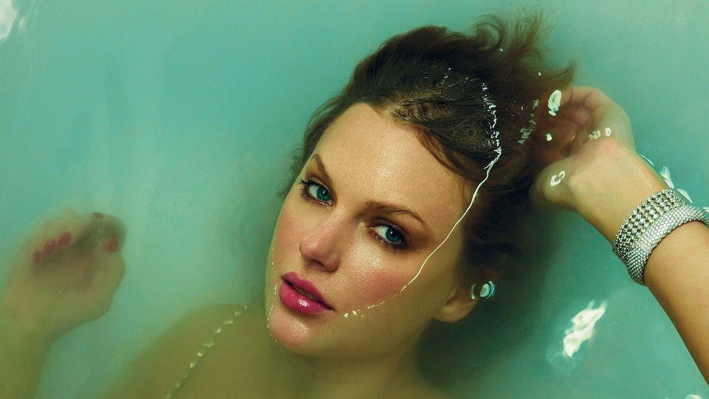 Album cover for Taylor Swift's The Life of a Showgirl, showing the star submerged in water, while still wearing her stage outfit
