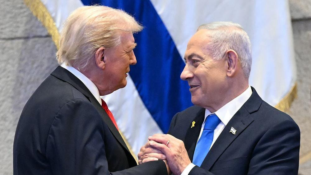 US President Donald Trump is embraced by Israeli Prime Minister Benjamin Netanyahu in Israel's Knesset