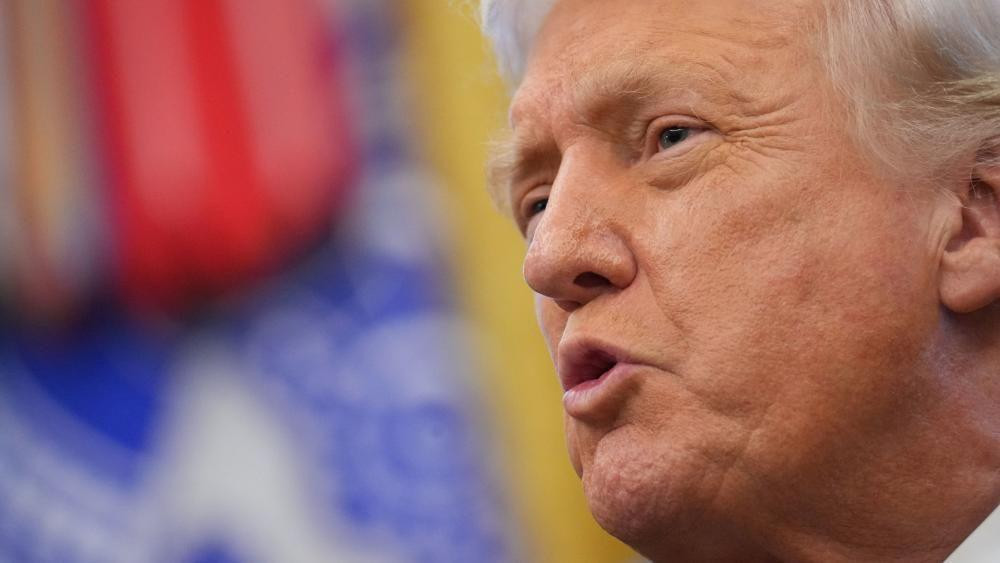 President Donald Trump speaks to reporters in the Oval Office