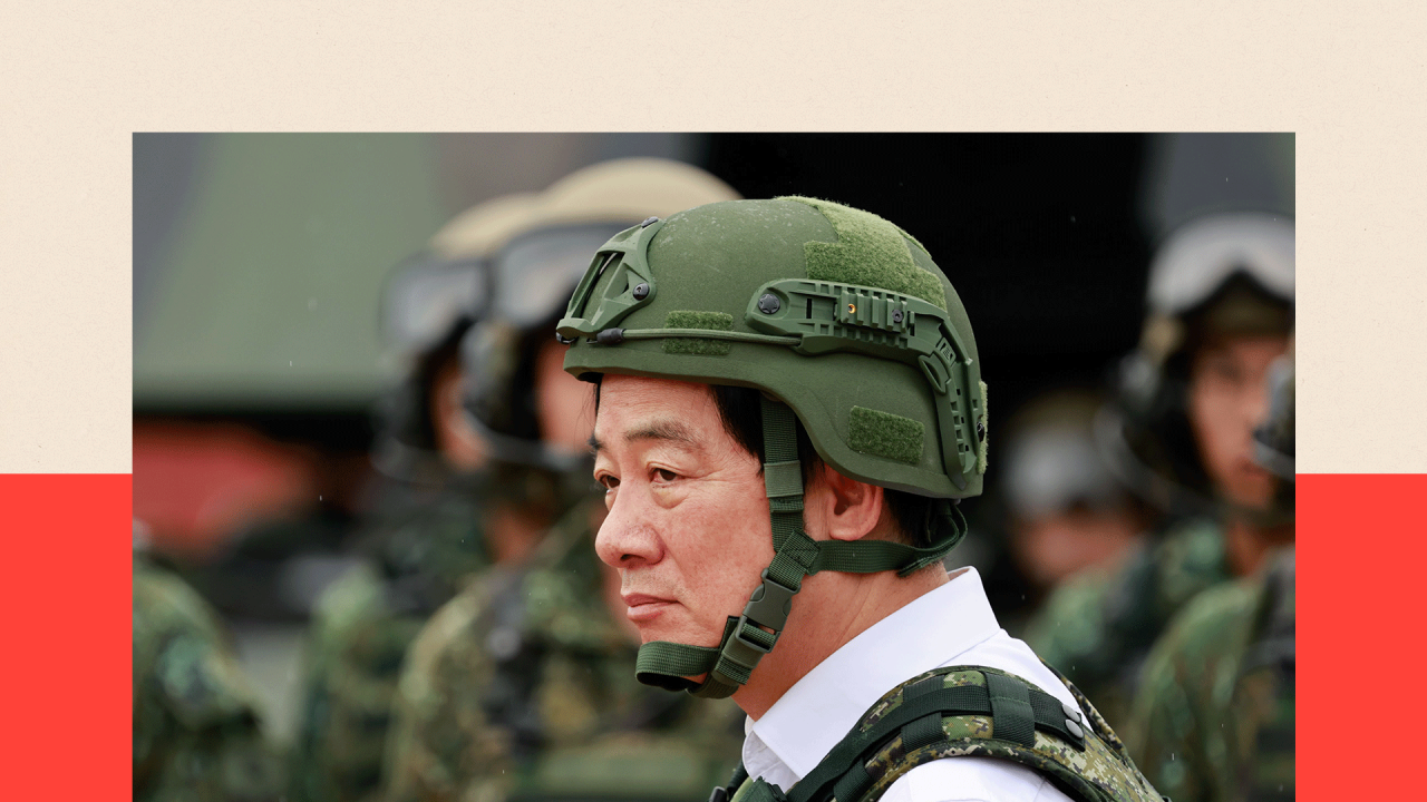 Taiwanese President William Lai in army gear, including a green helmet 