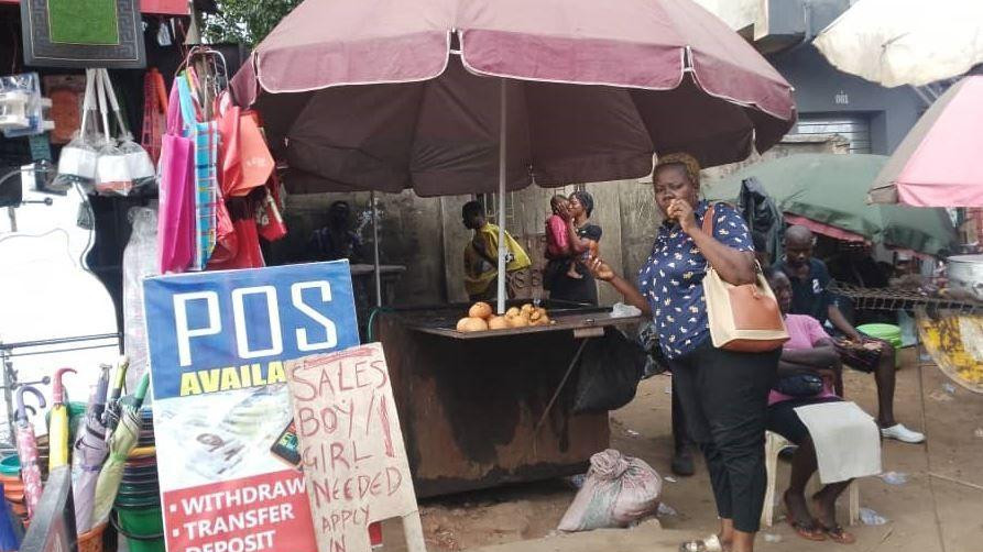 Stella Osiegbu eating fish roll she bought it from a street vendor 