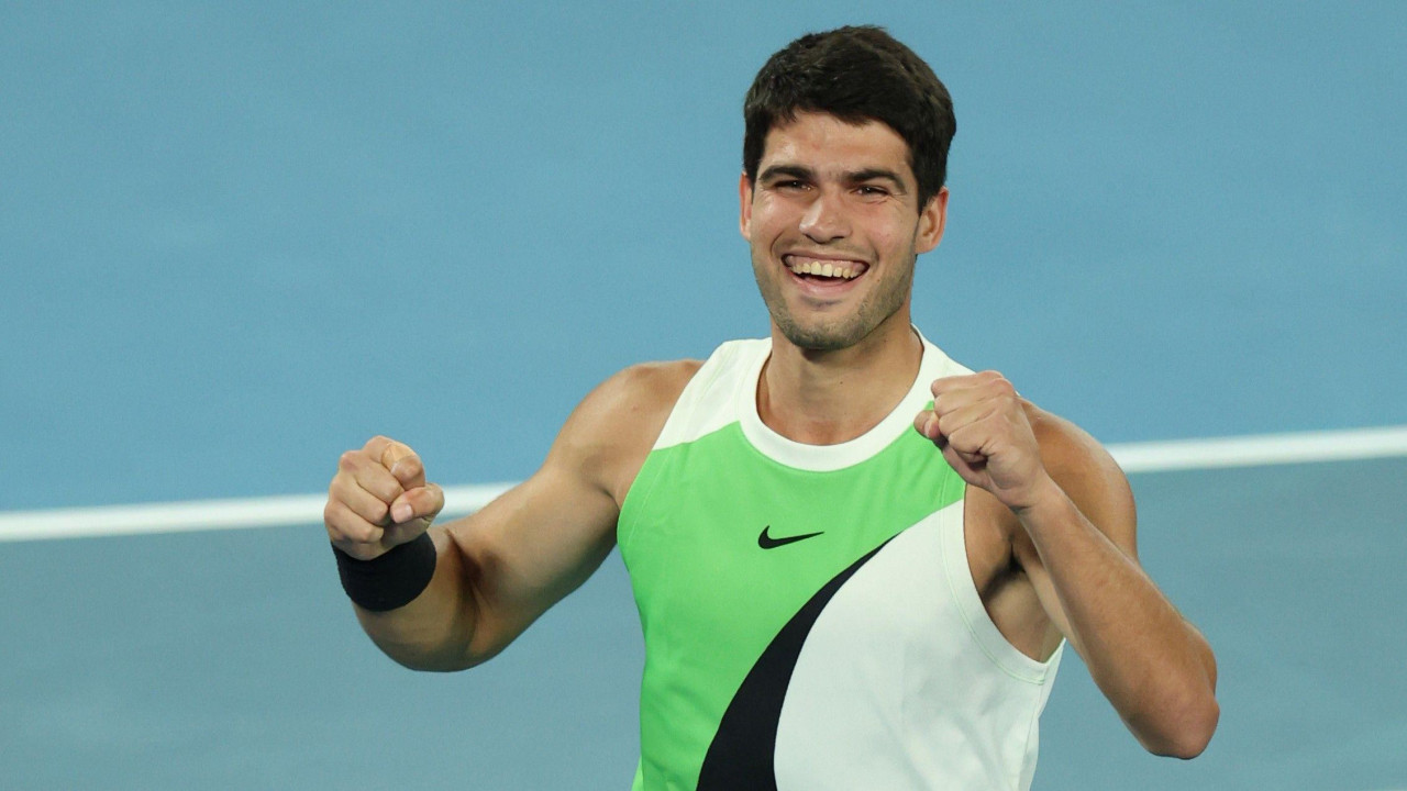 Carlos Alcaraz smiles after winning the Australian Open