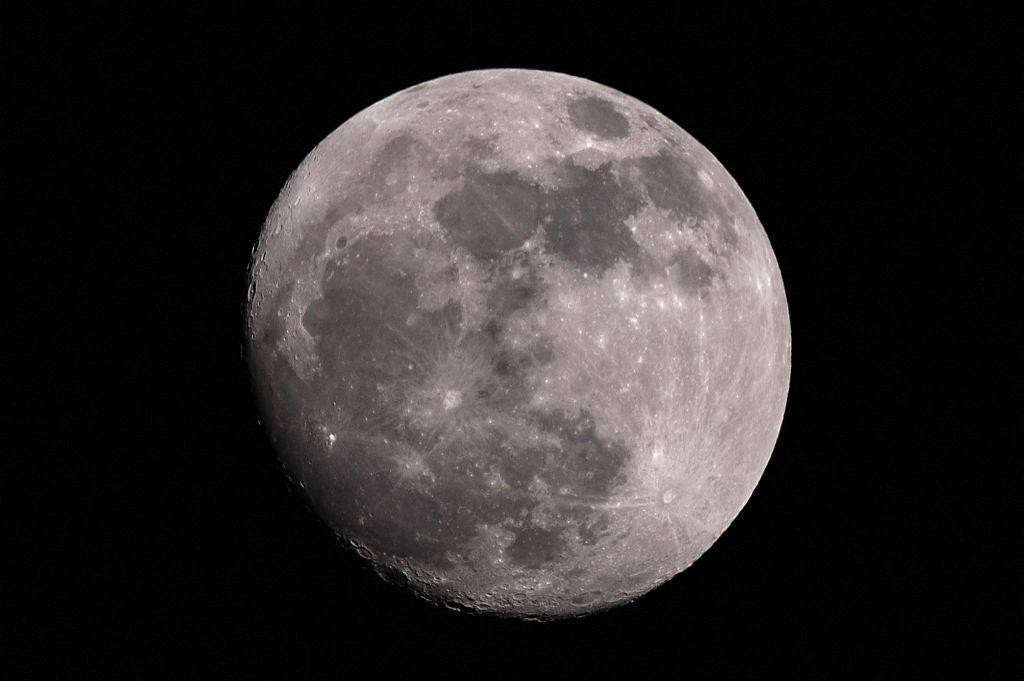 A large waxing Gibbous moon in the sky over Bogota