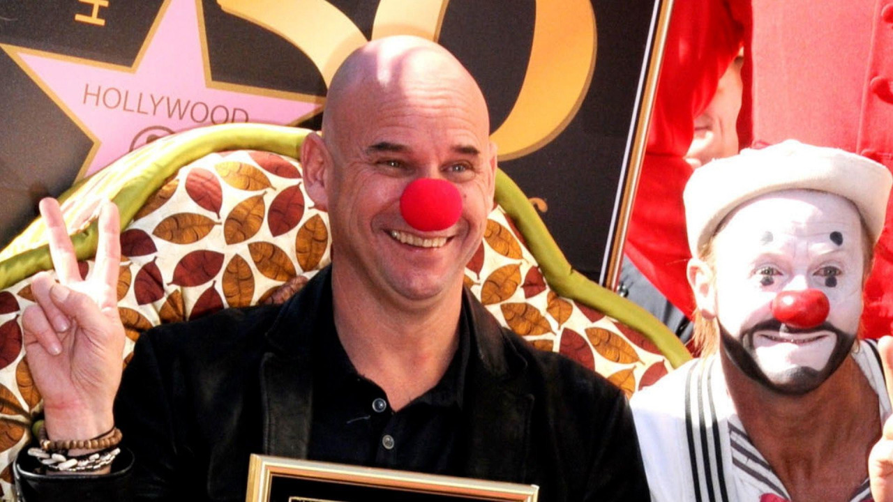 
                    Guy Laliberté attends the Ceremony honouring him with a star on the Hollywood Walk of Fame on 22 November. He is wearing a red clown’s nose and has his hands in a V- sign