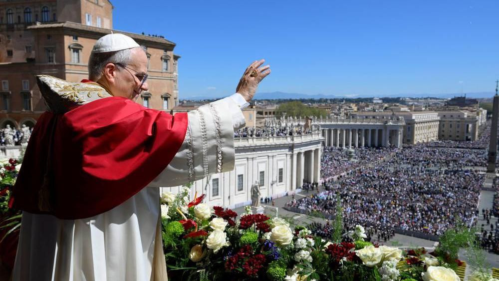 Pope Leo XIV waves from the main balcony of St. Peter's Basilica