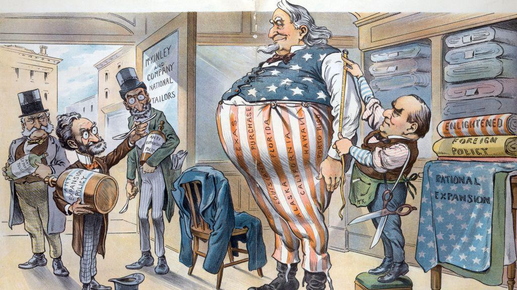 Karikatura objavljena u tadašnjoj štampi prikazuje krojača kako uzima mere visokom, krupnom čoveku odevenom u boje američke zastave. U prostoriju u tom trenutku ulaze još trojica muškaraca noseći velike tegle i kašike. Na jednoj od tegli stoji natpis „anti-ekspanzionistička politika“.