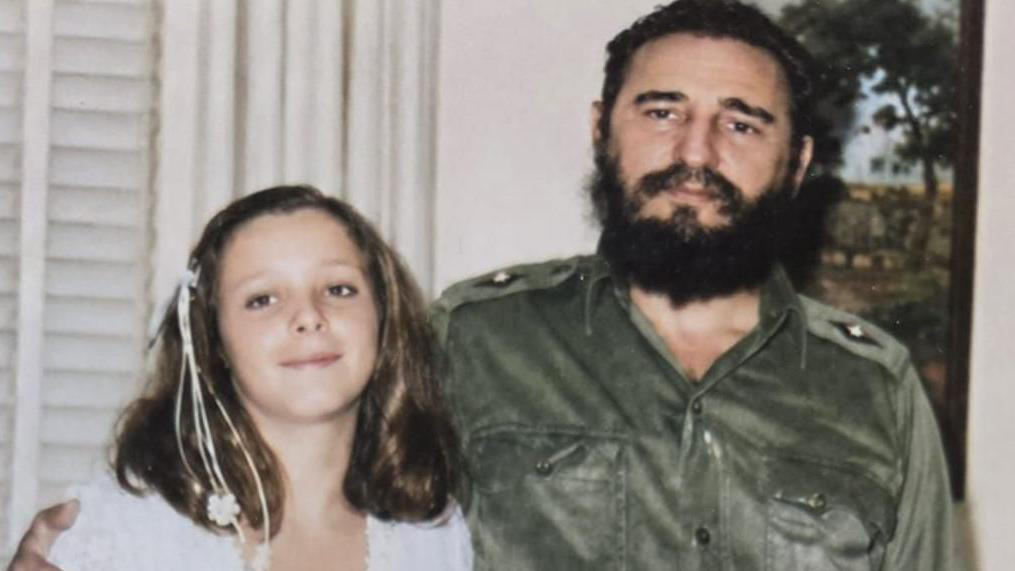 The late Cuban leader Fidel Castro, wearing a green military uniform, is seen alongside his daughter, Alina Fernandez, in a photo taken in the 1960s.