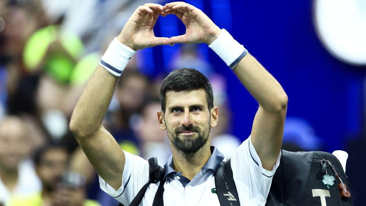 Novak Djokovic makes a heart shape with his hands after exiting in the US Open first round