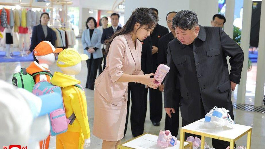 Kim Jong Un with his daughter Kim Ju Ae looking at shoes 