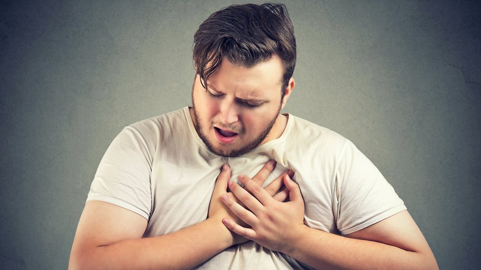 An actor simulating a heart attack