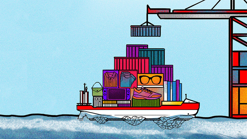 A ship full of cargo containers at sea with mountains of barnacles stuck to its bottom side