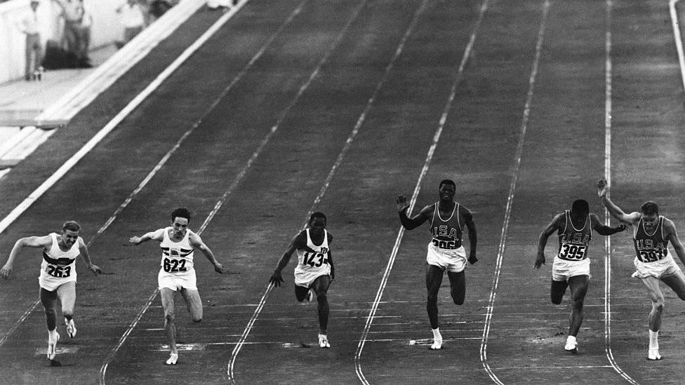 Sprinters running a 100m heat at the 1960 Rome Olympics