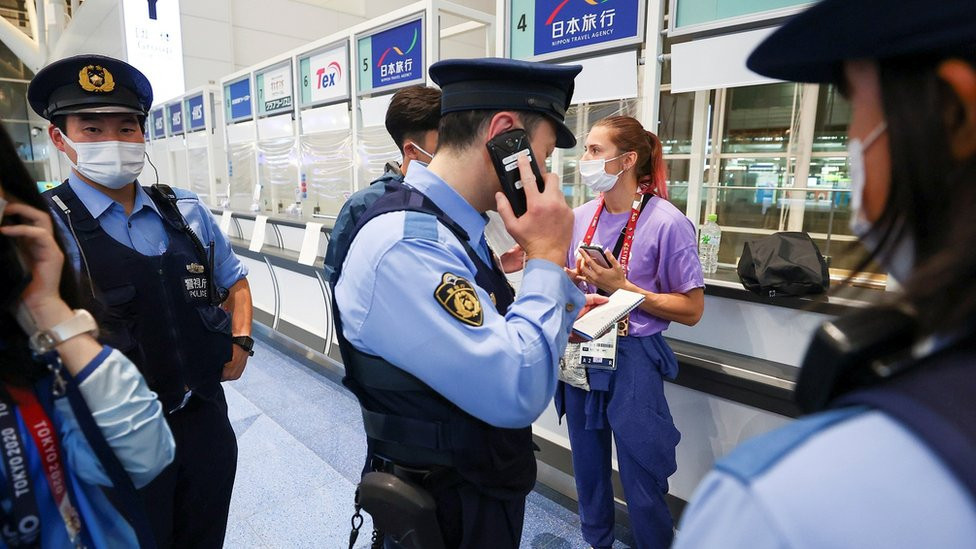 Krystina Timanovskaya surrounded by police