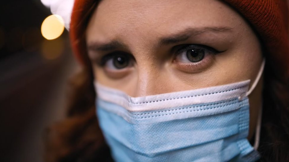 Young woman with face mask