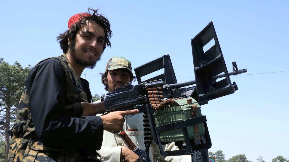 Taliban forces patrol a street in Herat, Afghanistan