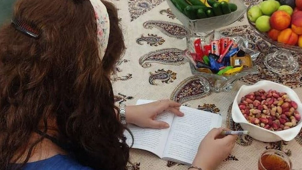 Mahsa writing a note