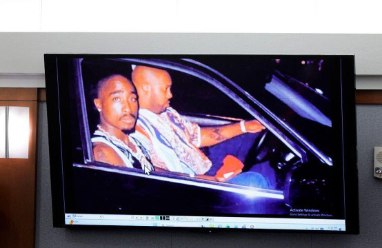
                    A 1996 photo of rapper Tupac Shakur (L) and Marion "Suge" Knight is displayed during the Duane Davis murder trial, related to the 1996 killing of the rapper, at Clark County District Court at the Regional Justice Center in Las Vegas, Nevada, on August 17, 2026. The trial of the former gang leader a