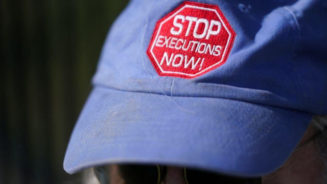Hat of protester before a firing squad execution in South Carolina in 2025
